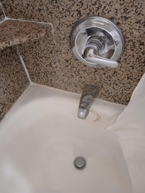 Rusty tub, badly worn and calking horribly done.