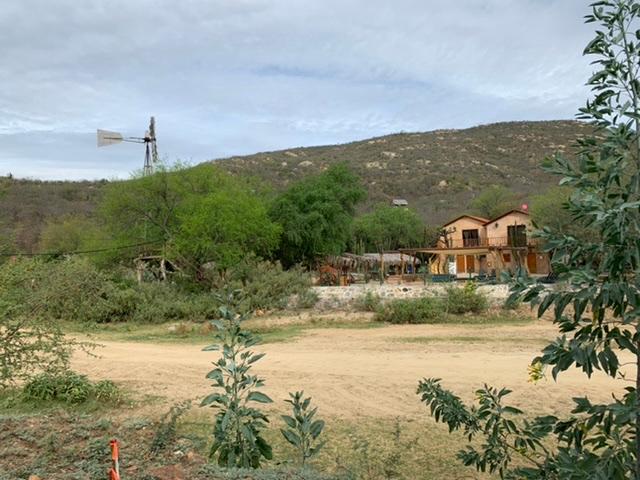 Cabanas El Triunfo across dry creek bed