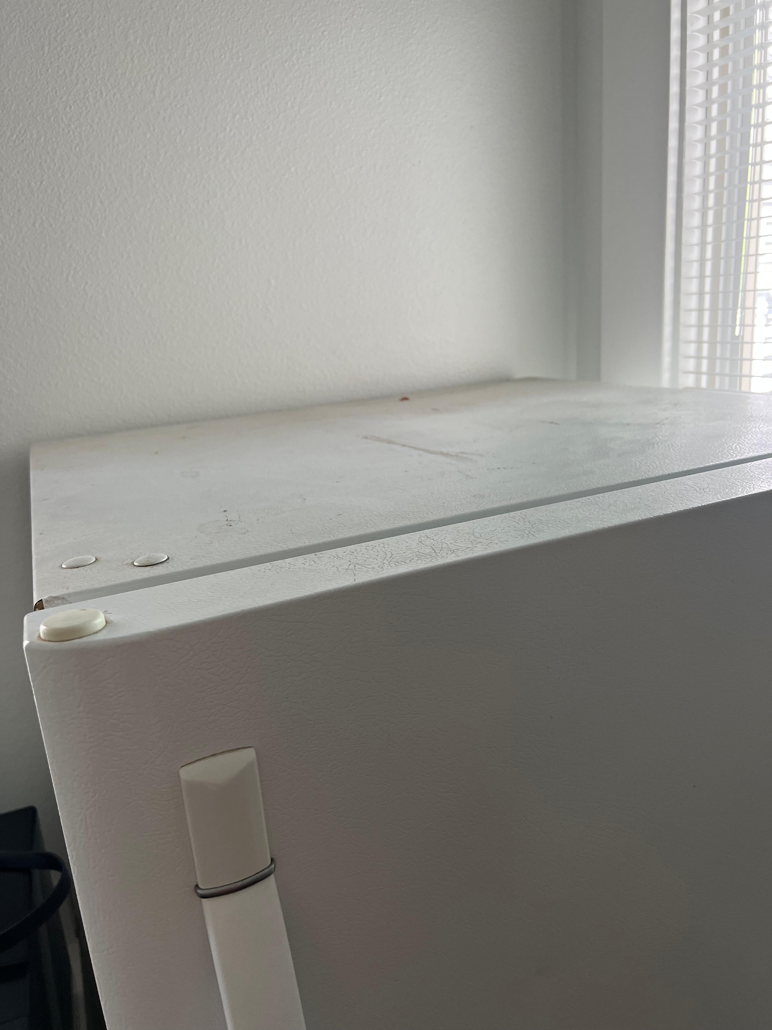 Dirt on fridge and light fixtures. 