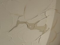 Close-up of the leak in the ceiling of the primary bedroom.
