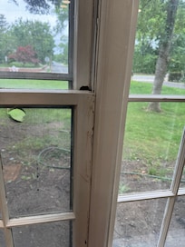 Windows that were painted and couldn’t be properly open or shut. And notice the giant hole in the screen.