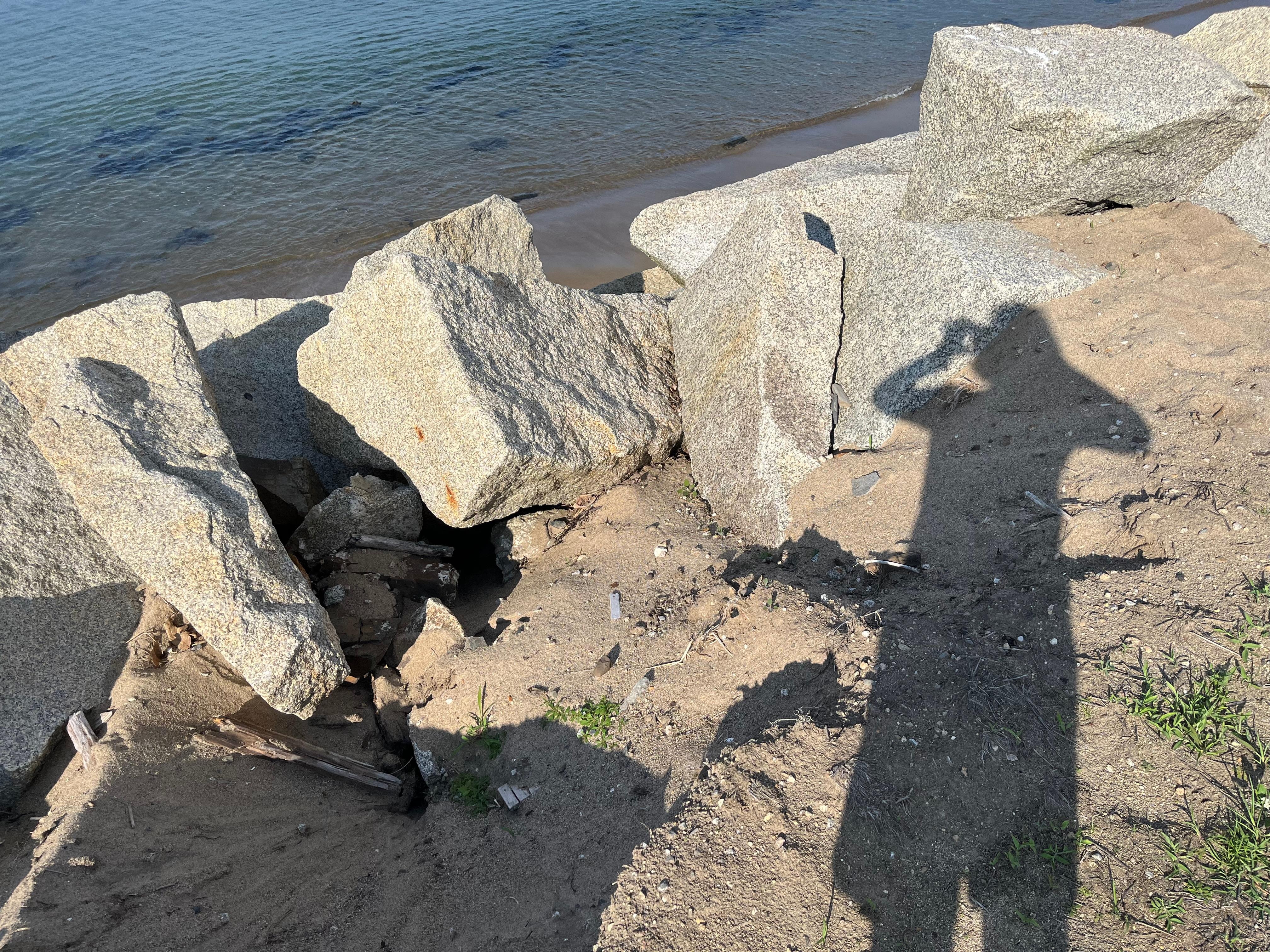 Steep rocks, where the stairs should be to access the beach. 