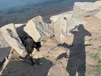 Steep rocks, where the stairs should be to access the beach.