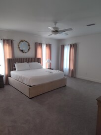 2nd floor main master bedroom - very nice! Offset patio ledge with no chairs on it.