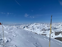 Marvelous views at Top of grande Motte 3450m - reach by funicular and cablecar wide red run ski run down