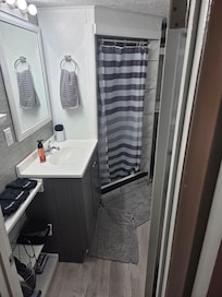 Bathroom is at bottom of stairs basically