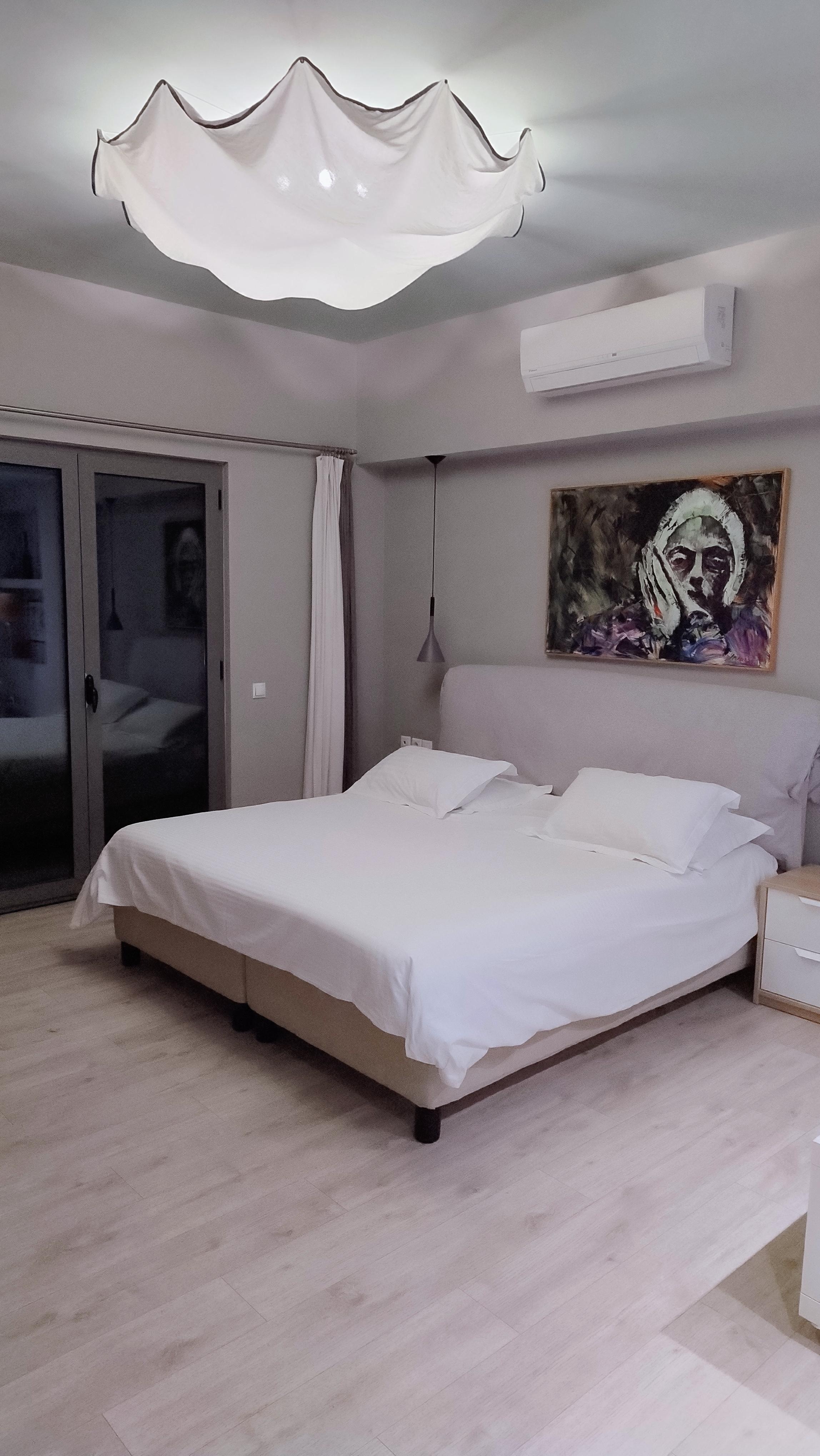 Huge bed in large apartment.