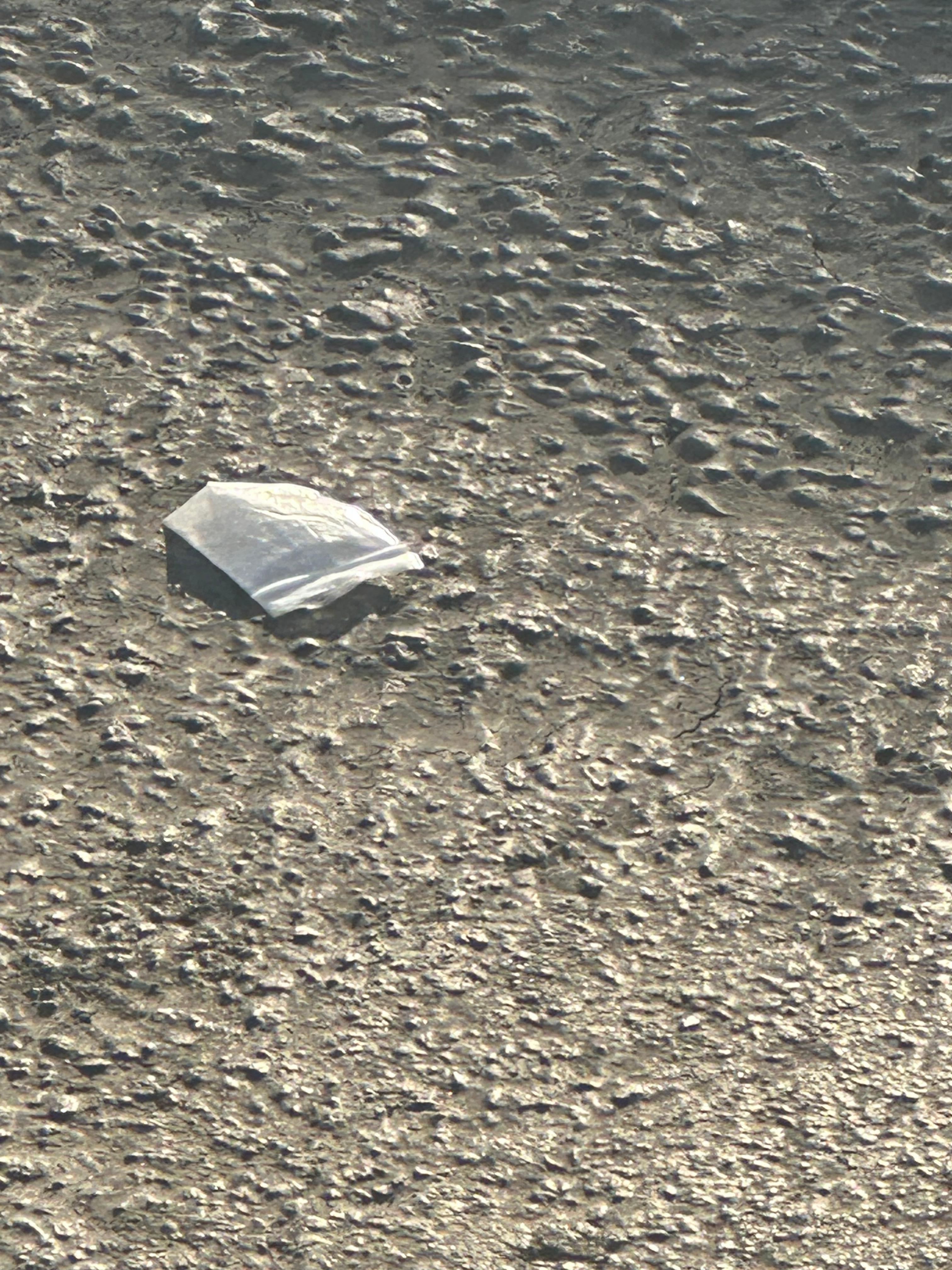 Bag of crack on the pavement parking lot