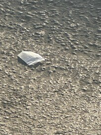 Bag of crack on the pavement parking lot