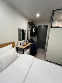 Tidy, but note with my large suitcase it did not fit in shelf.