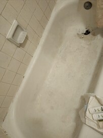 Shower tile grout painted to hide mold(?)