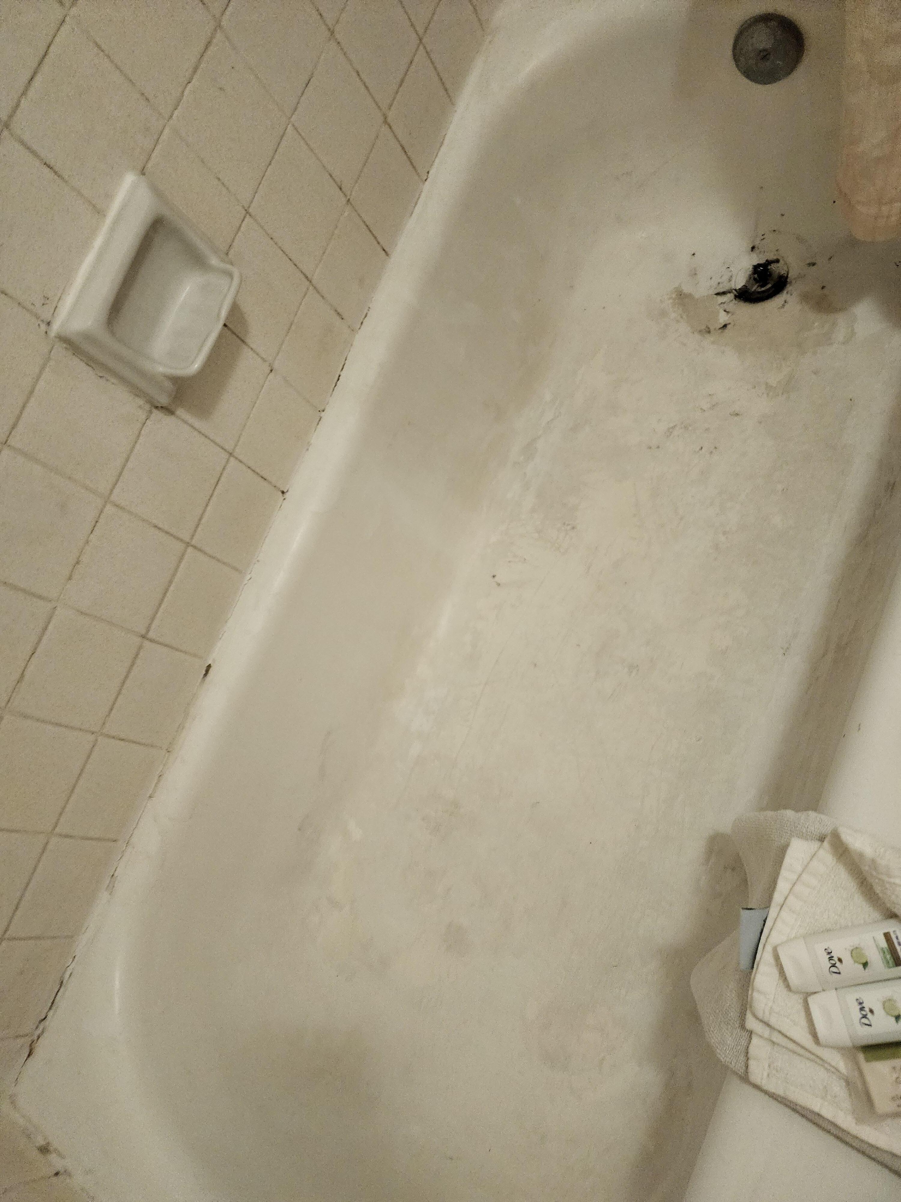 Shower tile grout painted to hide mold(?)