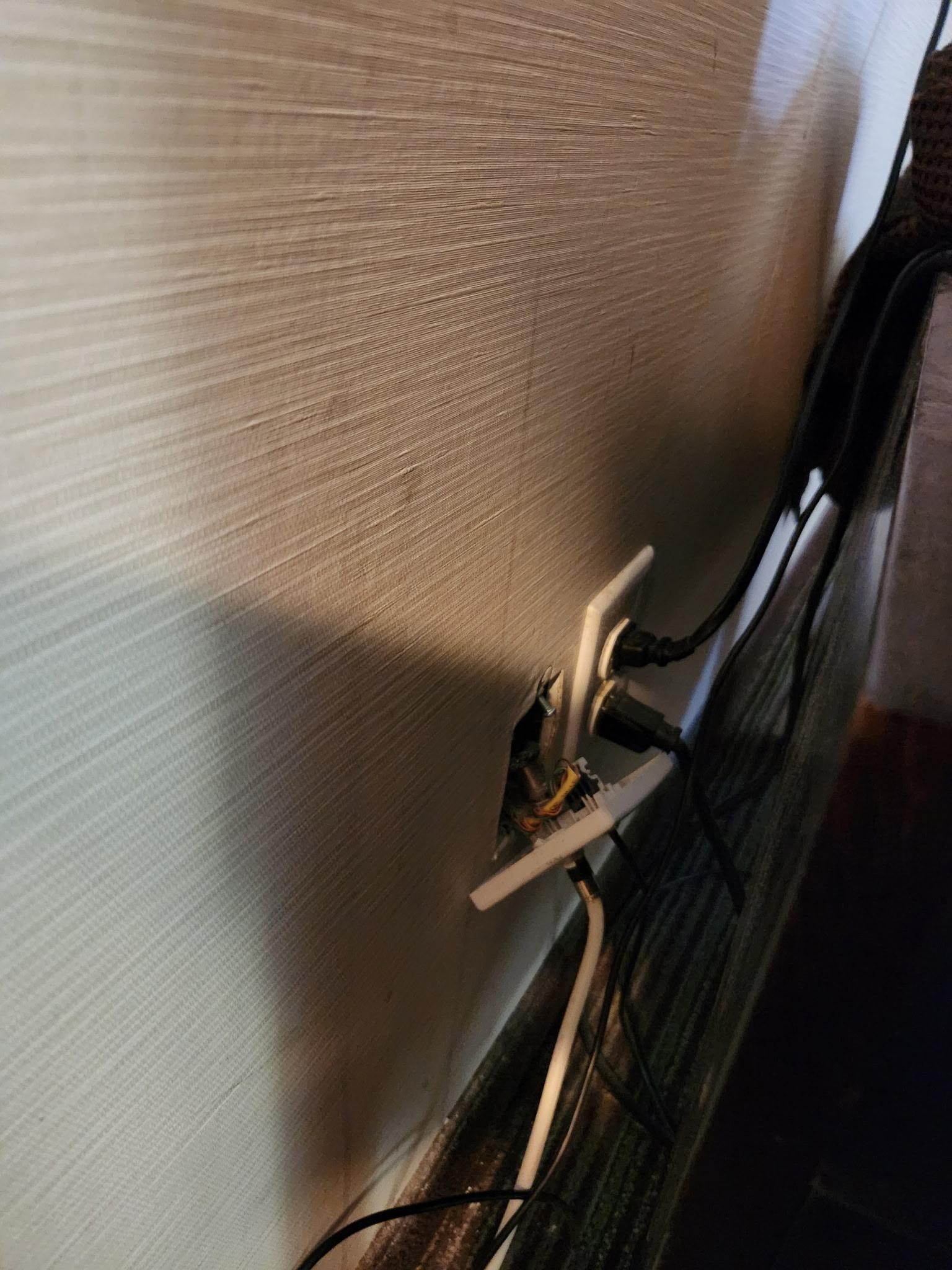 Power outlet hanging off wall. Tv did not work