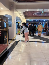 Staff was using mop to remove water from lobby