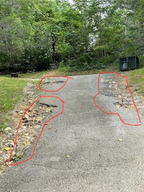 potholed steep driveway