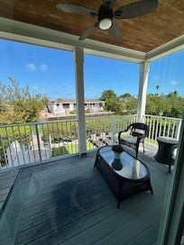 Lovely screened in porch, just needs a few more chairs.