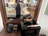 Dresser in front of a window. Odd