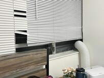 Broken window covered by duct tape