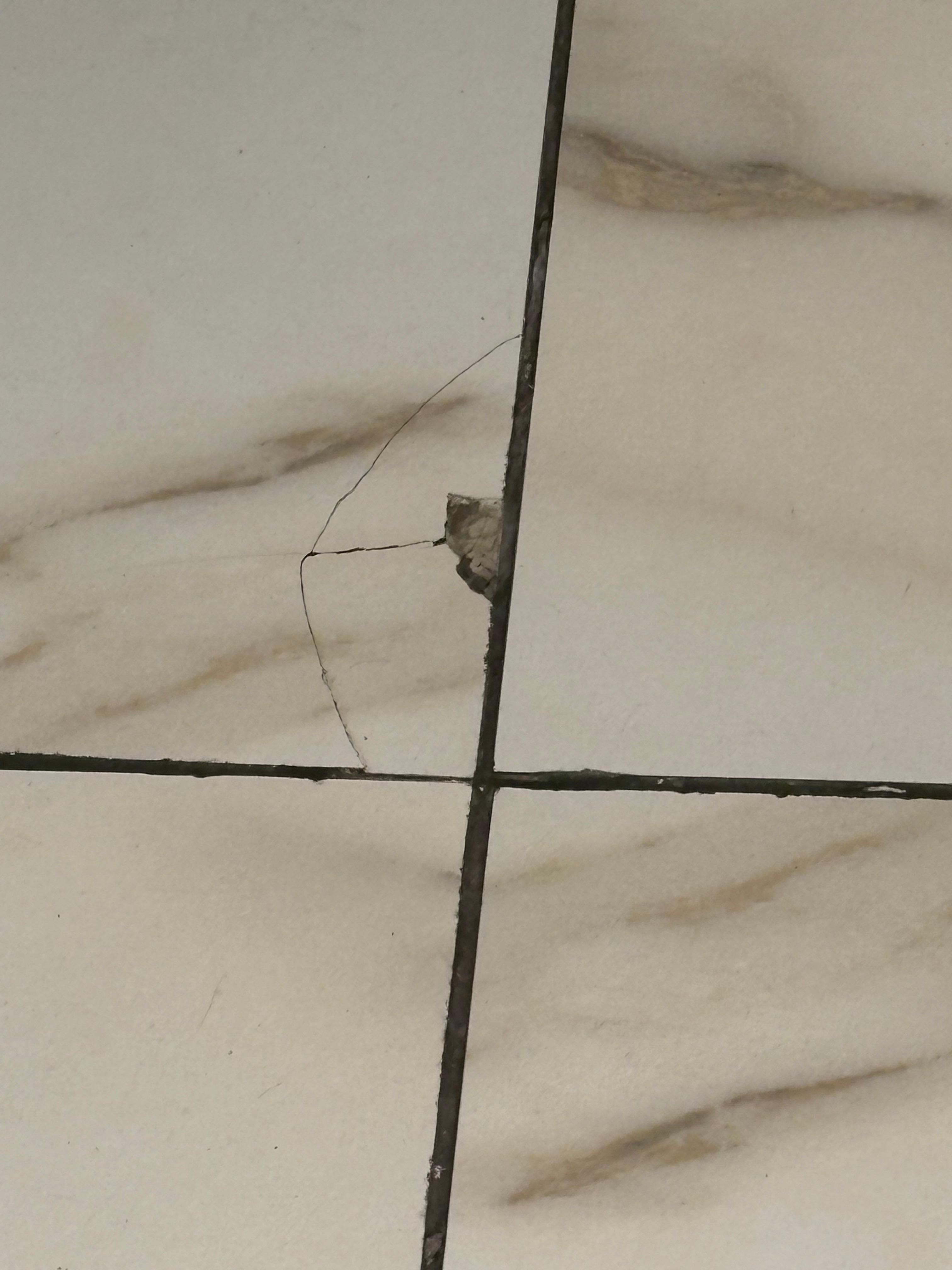 Broken tile in bathroom