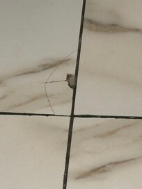Broken tile in bathroom