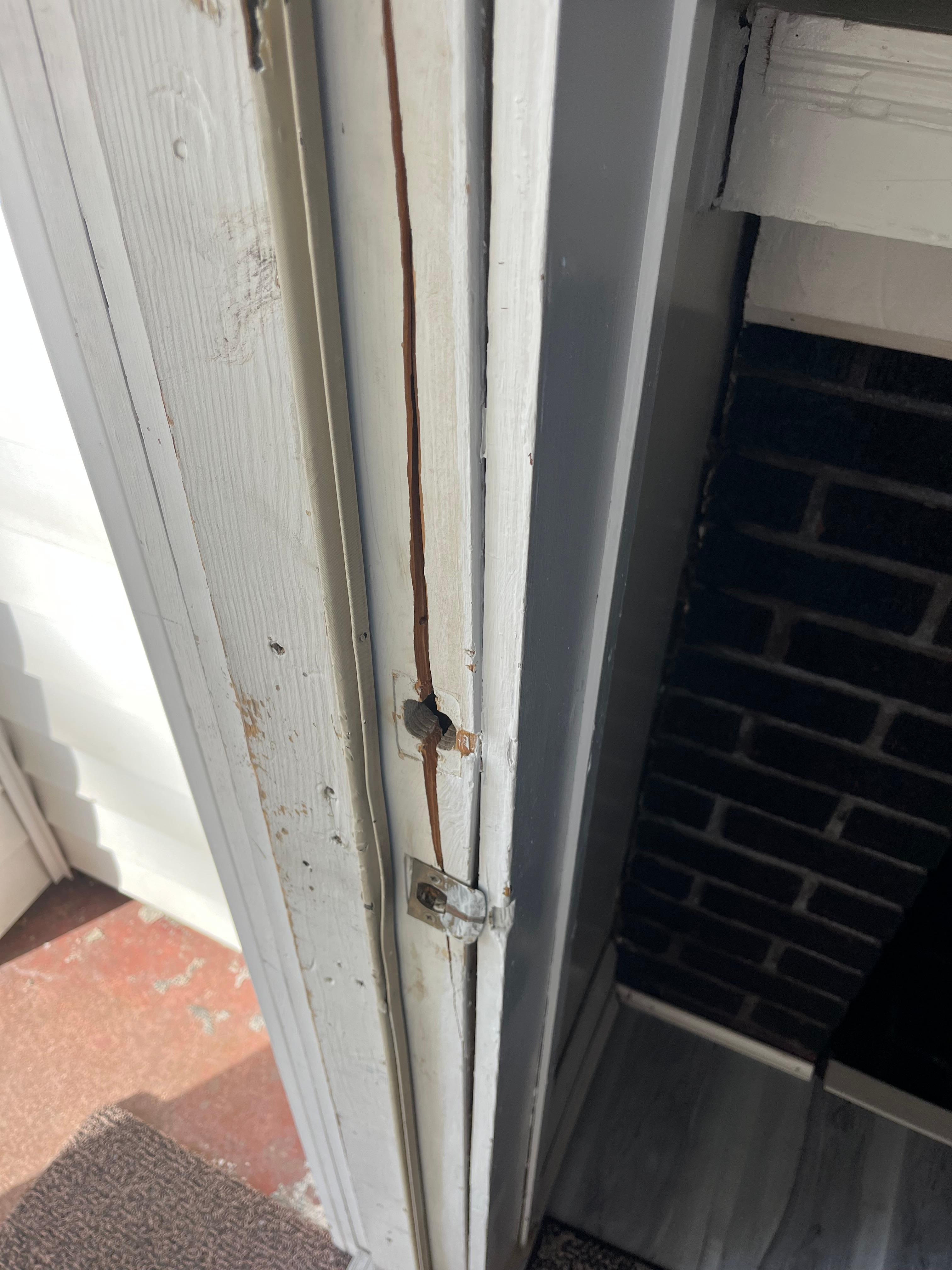 Front door jam is badly damaged. Not very secure. 