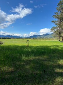 Two chairs with ottomans are available for relaxing and taking in the views