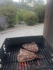 Bbq area.
Grilling up some T-Bones. Bring your own briquettes.