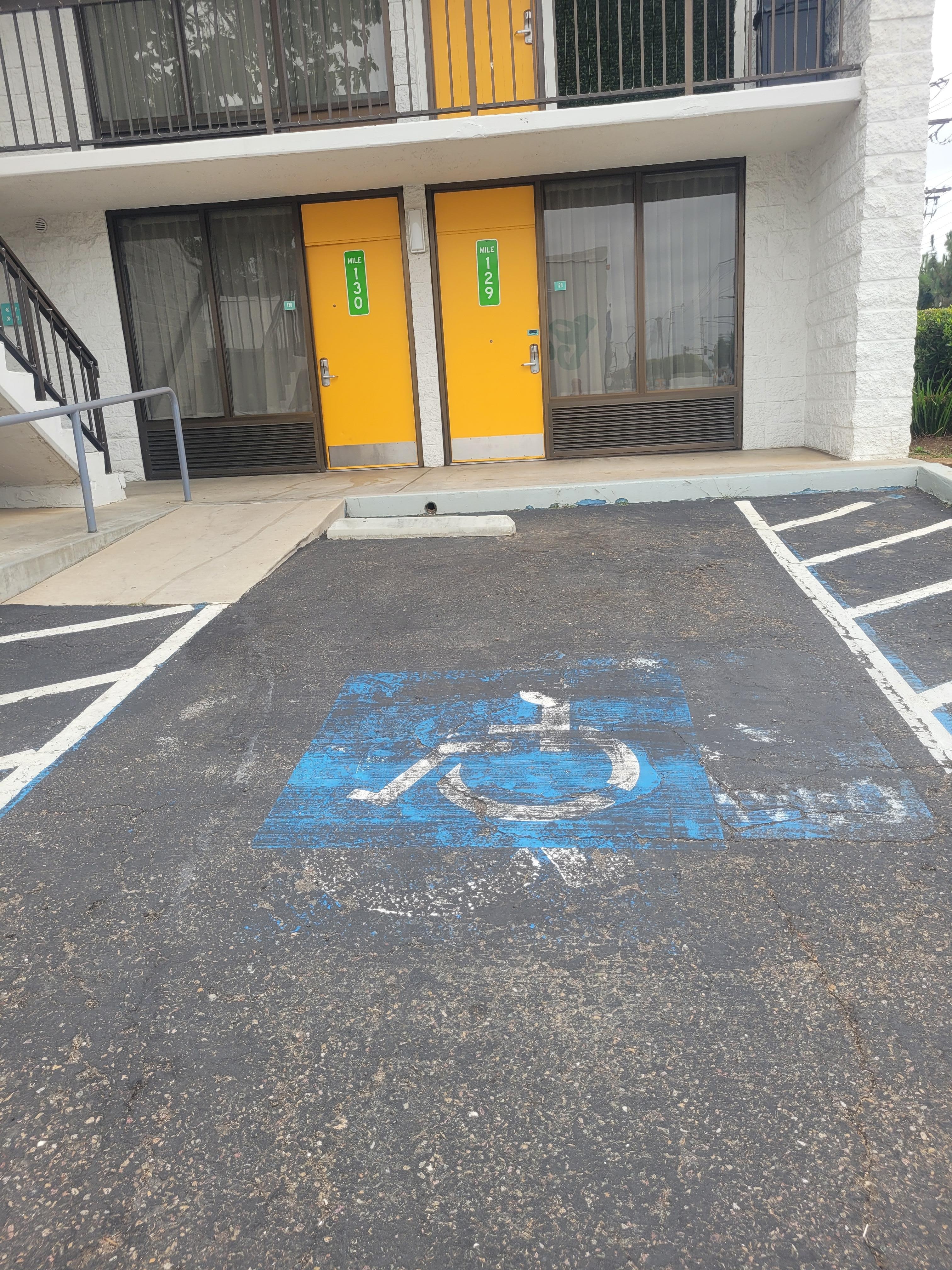 Photo of the handicapped spot I was told wasnt handicapped. Its tough when you can hardly walk and are at tims in a wheel chair and to be told its not handicapped when its marked as such is ridiculous. Im going to teview your hotel poorly everywhere