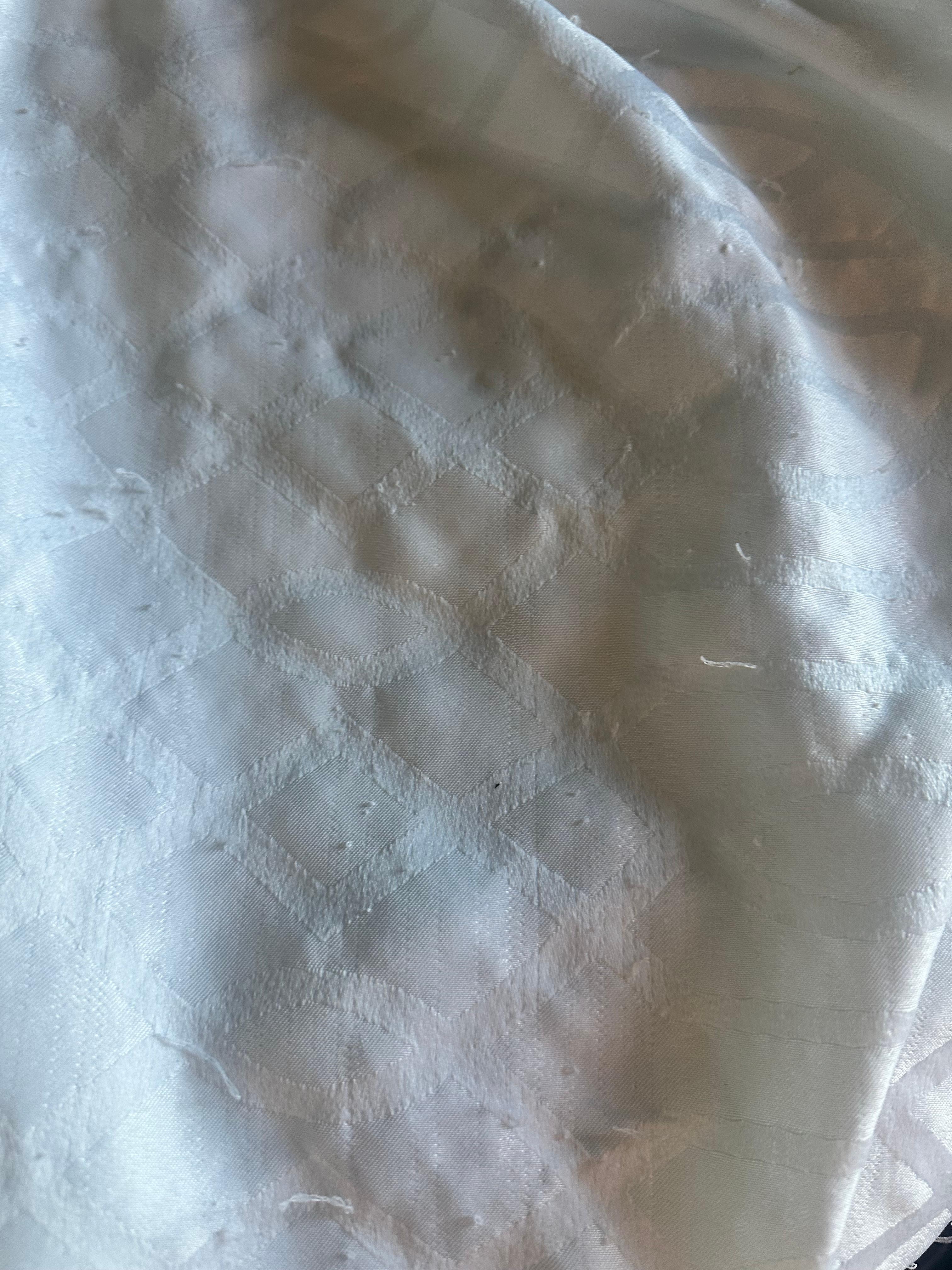 Stained bed coverlet 