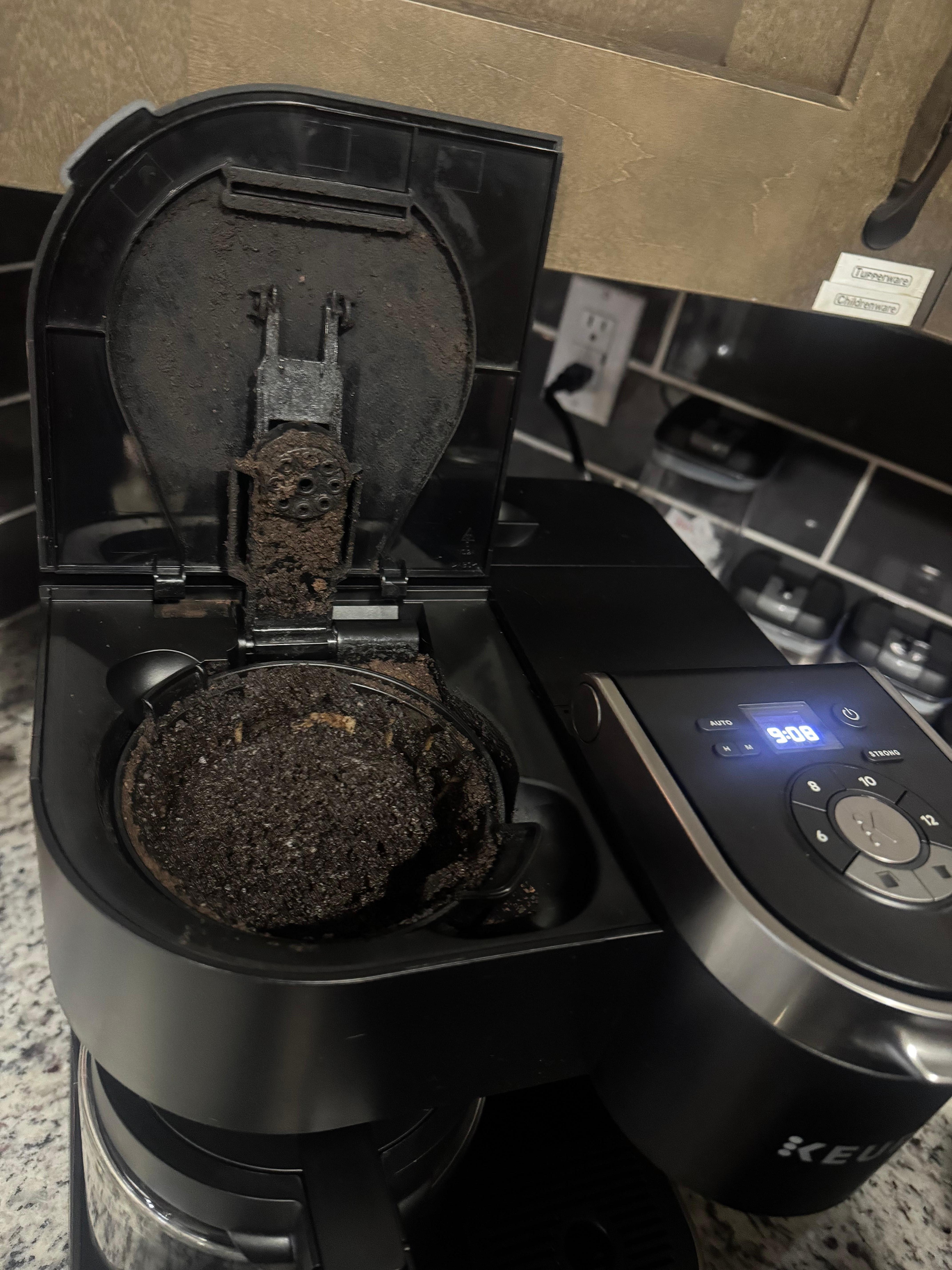 Opened the coffee pot to this surprise. Can tell it want cleaned in a while. 