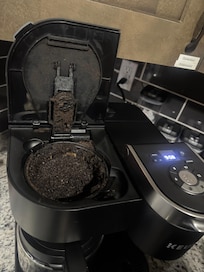 Opened the coffee pot to this surprise. Can tell it want cleaned in a while.