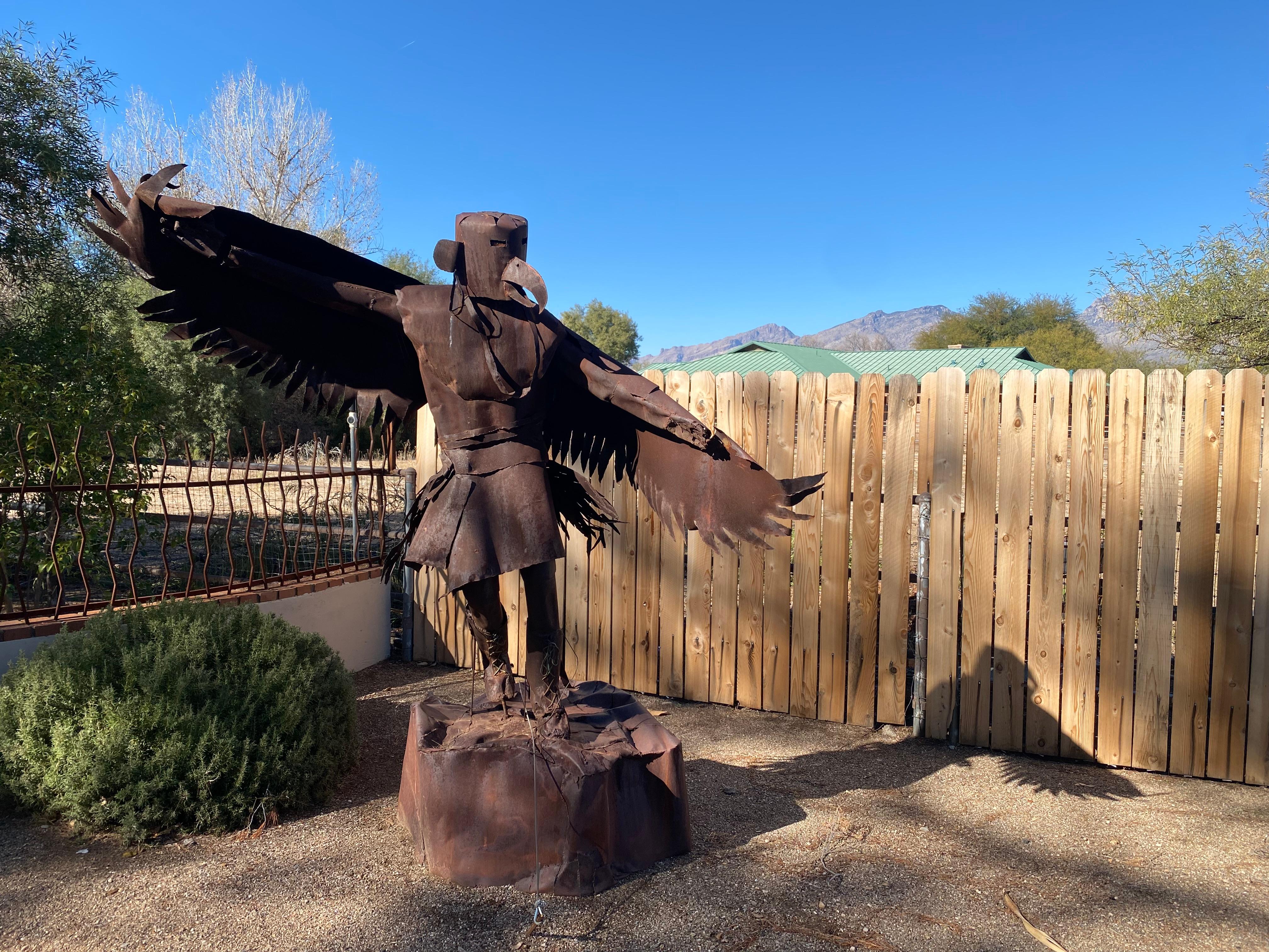 Many metal sculptures decorate the large yard. Plenty of shade, benches and walkways