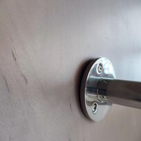 Clothing bar pulling out of the wall