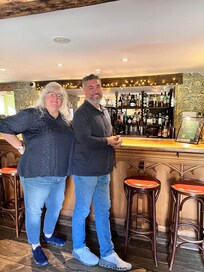 Posing in front of the cute bar which greets you upon entering the Inn