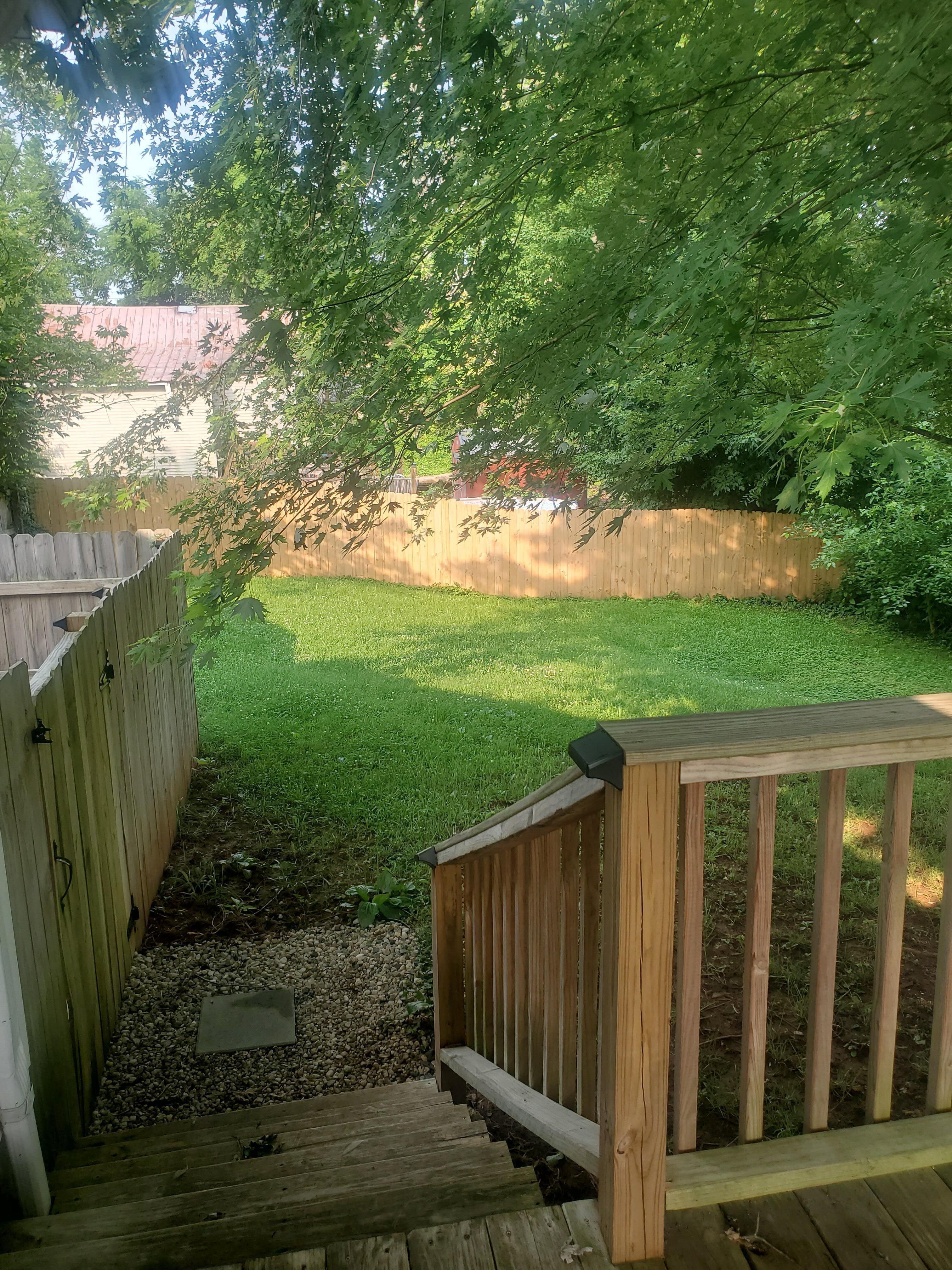 Back yard. Hot tub to the left in the gated area. Very nice