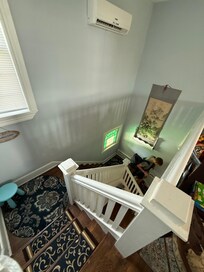 Stairway from the unit down to the private porch entrance