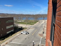 View from 4th floor with small wrought iron balcony.