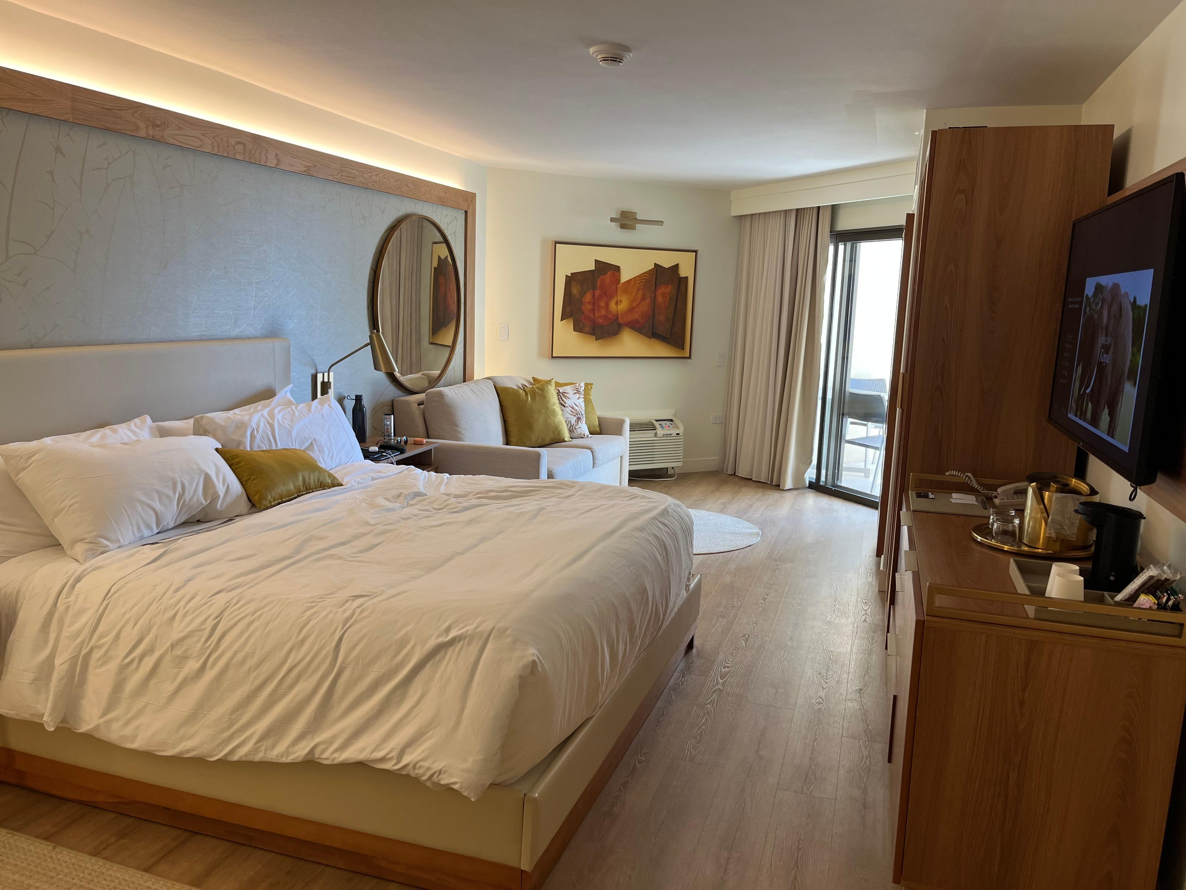 King bed room with partial ocean view