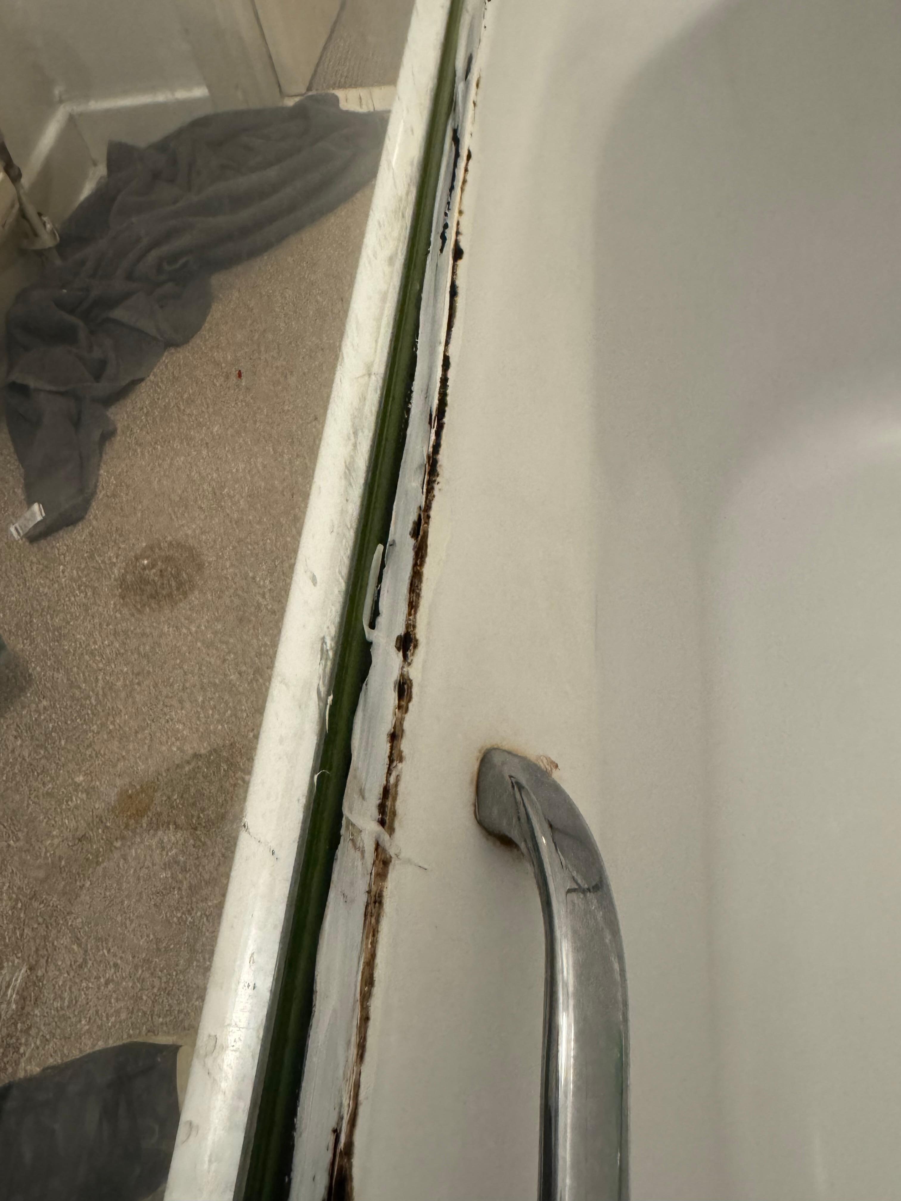 Shower screen siliconed closed hindering access 