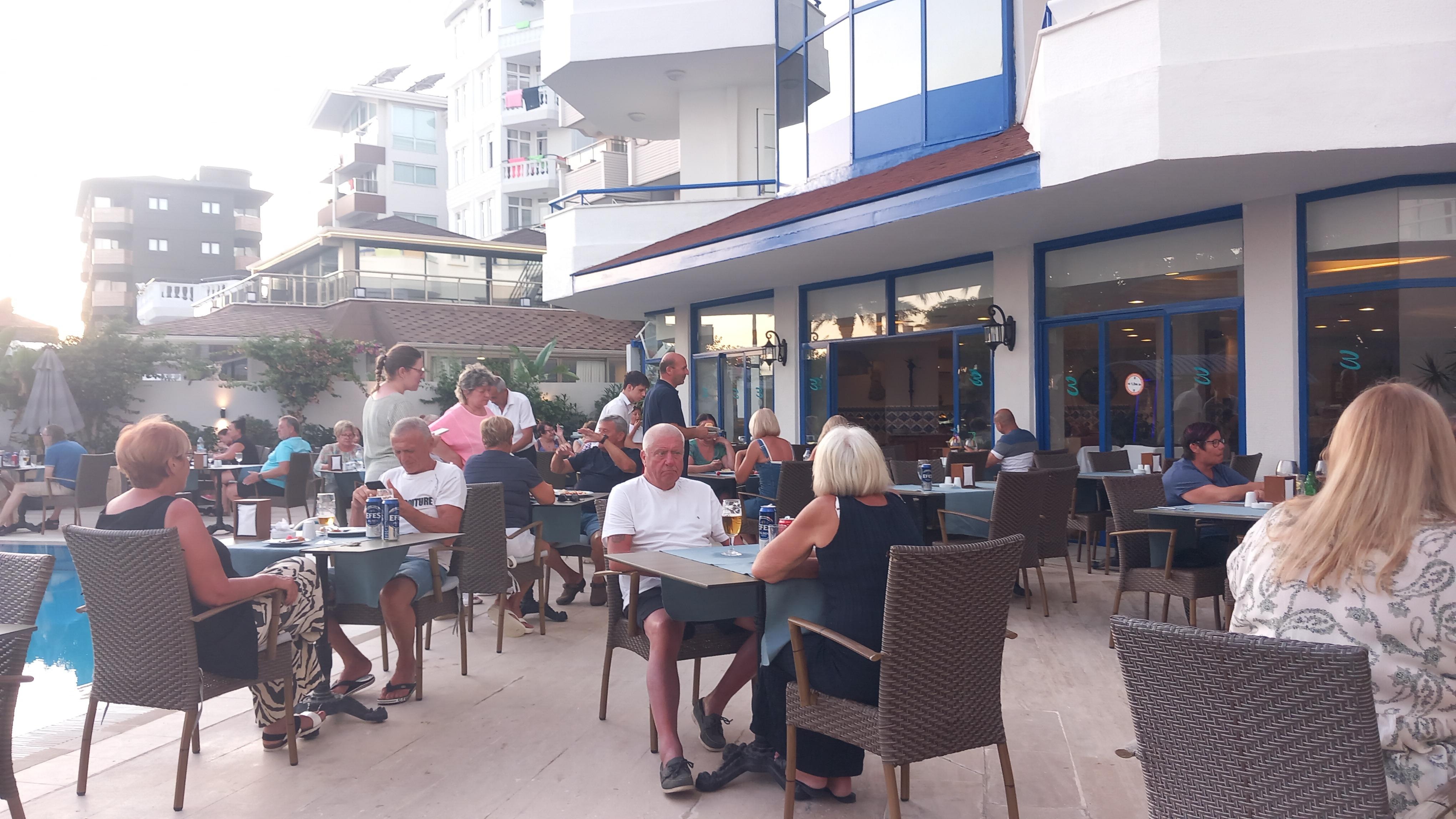 Breakfast and dining area beside the pool..