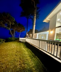 Back deck at night overlooking the ocean- beautiful!