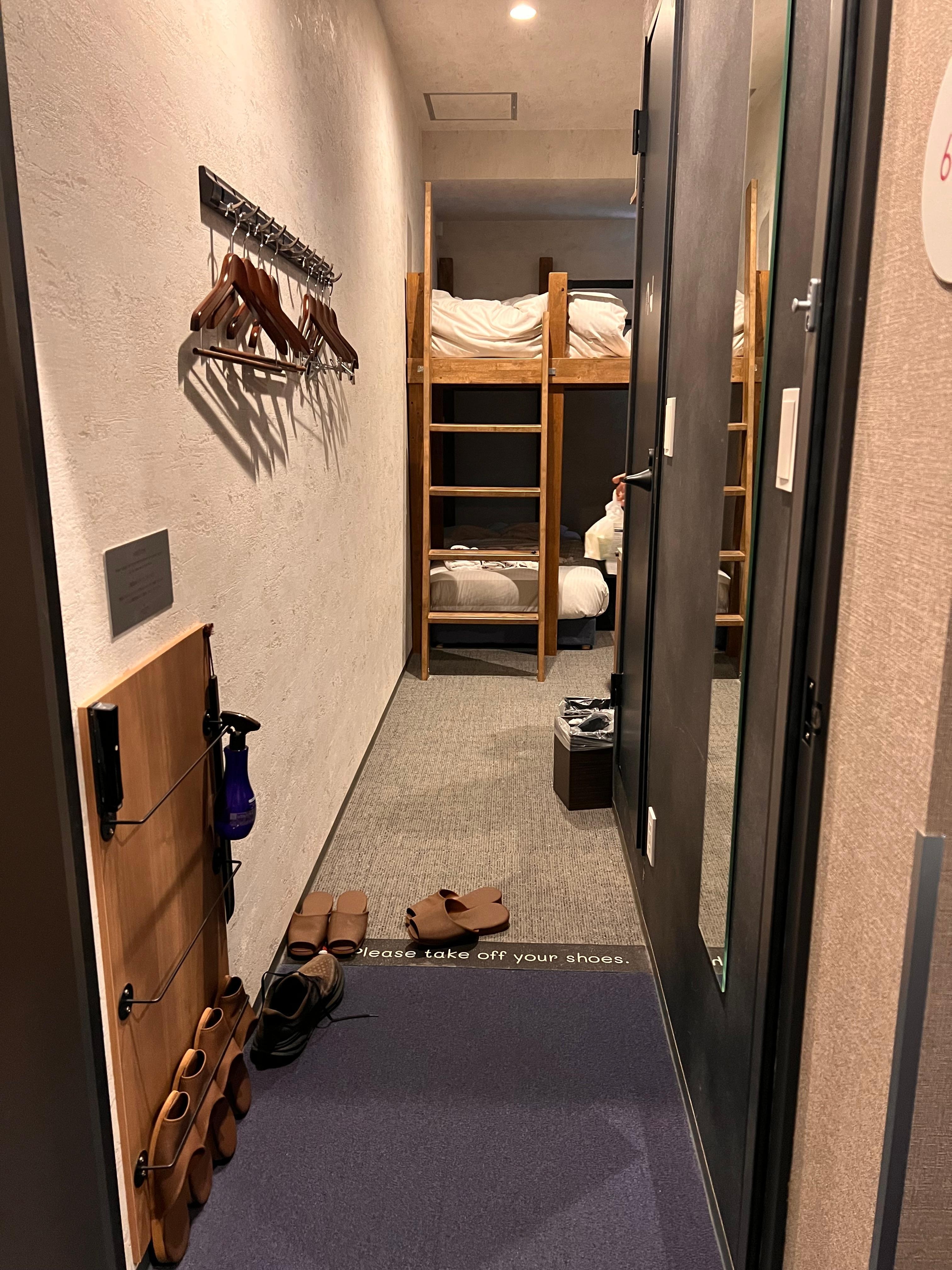 Bathroom with bidet toilet, walk in shower, and nice olive shampoo, conditioner, and body soap