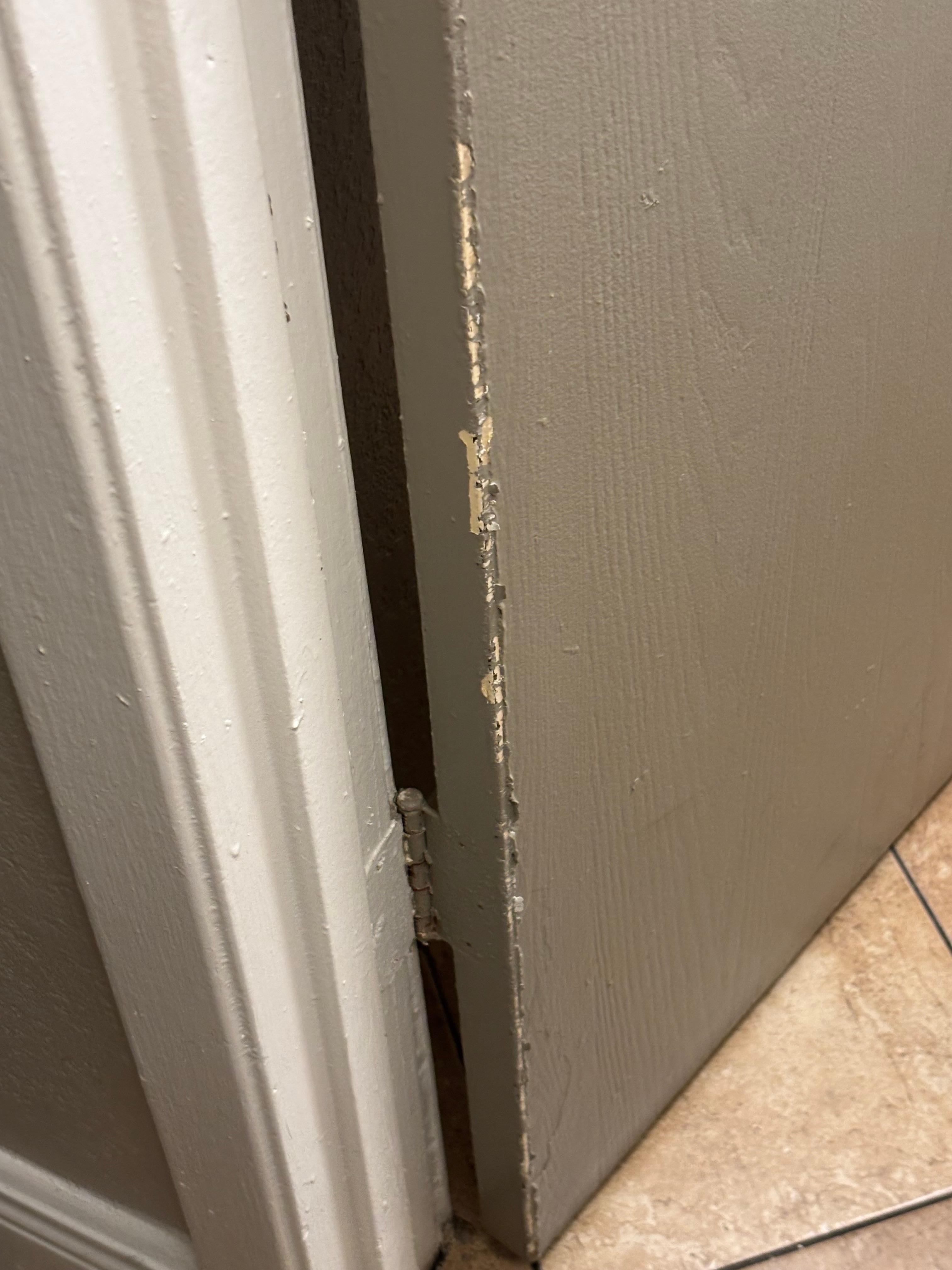 doorway to bathroom all broken and not even painted