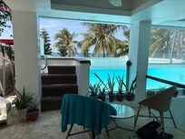 Tiny, untidy pool area. Those are the only 2 chairs!