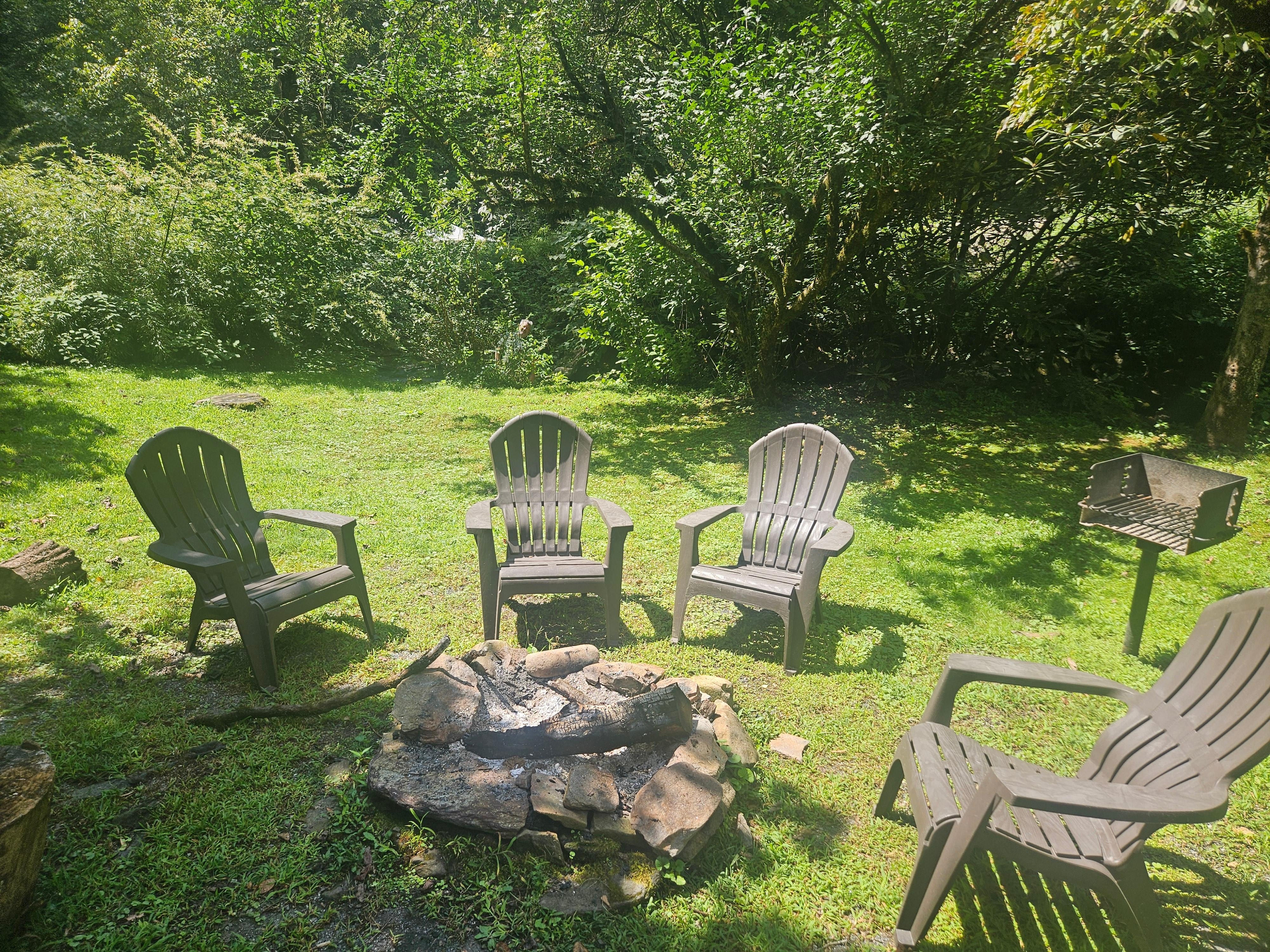 Backyard fire pit and charcoal grill. 