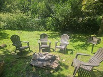Backyard fire pit and charcoal grill.
