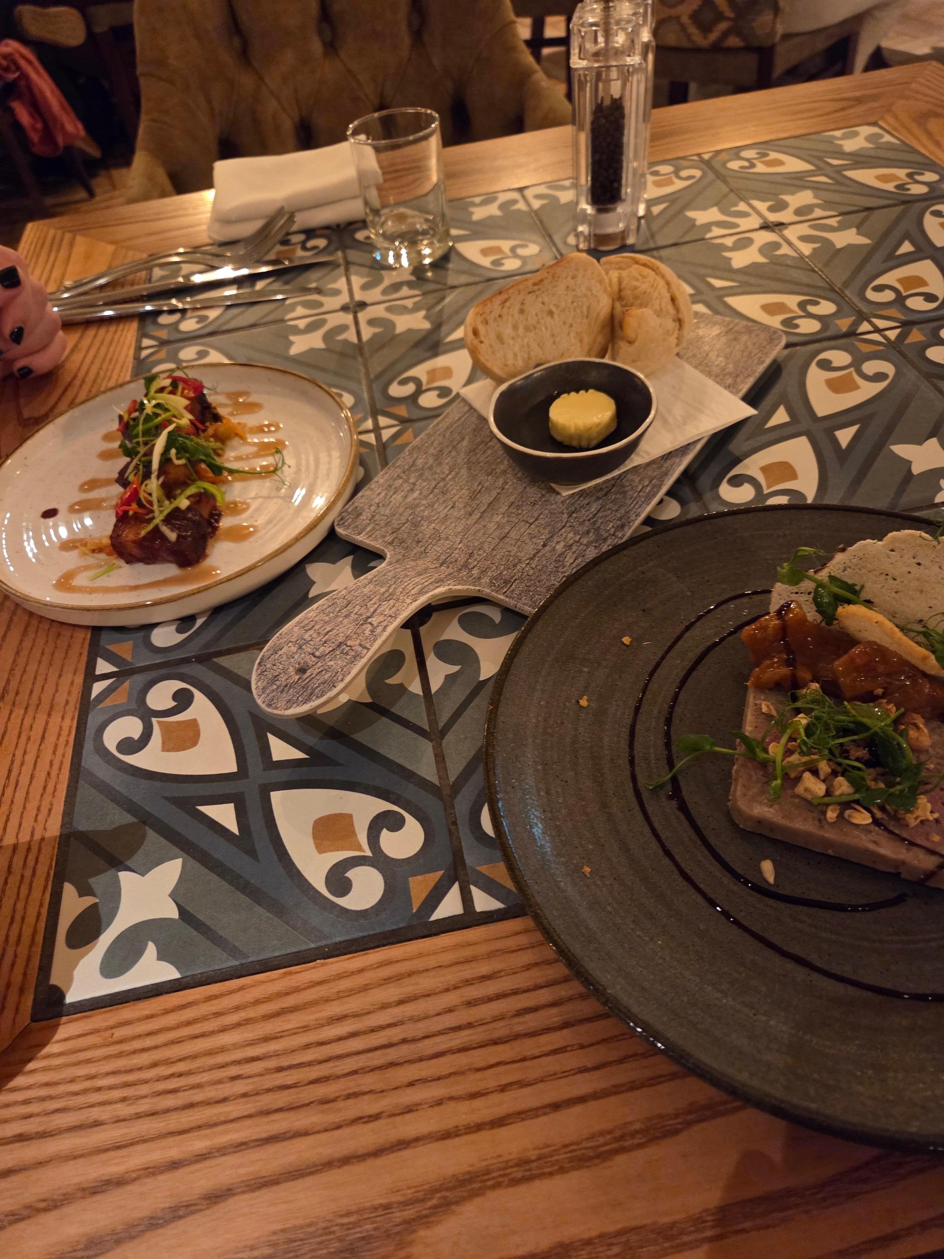 Starters at the restaurant- sticky BBQ pork belly and duck liver parfair