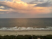 Late afternoon on a  day with a few rain clouds.