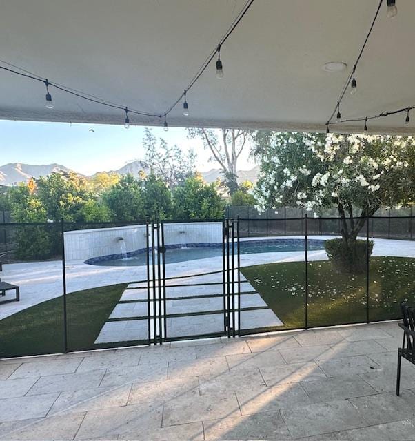 The security fencing around the pool.