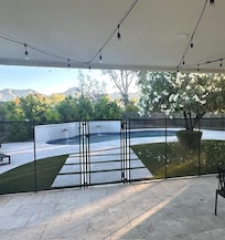 The security fencing around the pool.